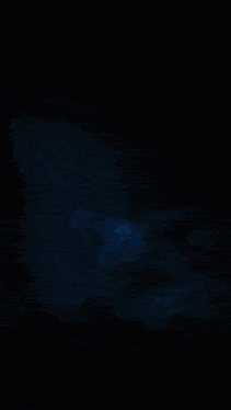 a dark blue background with a few spots of light on it
