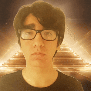 a man wearing glasses and a black shirt stands in front of a pyramid