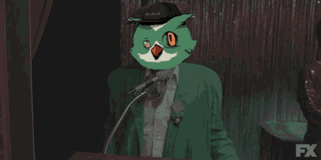 a man in a green jacket with an owl on his head says goodnight