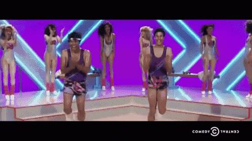 a group of people are doing exercises on a stage with the comedy central logo in the corner