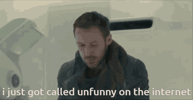 a man with a scarf around his neck says i just got called unfunny on the internet ..