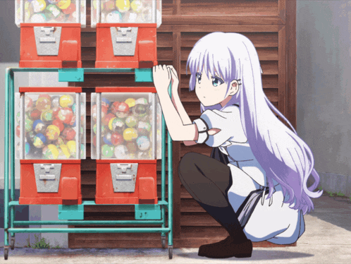 a girl with purple hair is squatting in front of a machine that has the letter h on the front