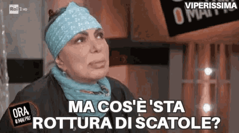 a woman wearing a headband and a scarf says ma cos e 'sta rottura di scatole ?