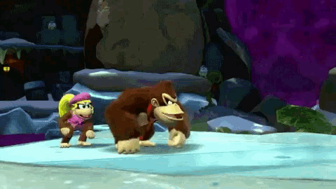 donkey kong and diddy kong are playing a video game on ice