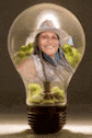 a light bulb with a picture of a woman in a cowboy hat inside of it .