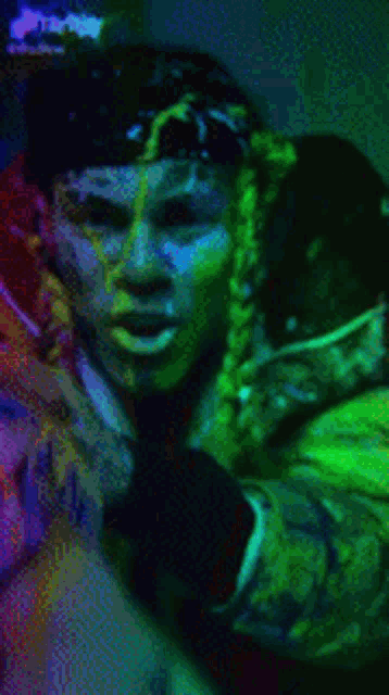 a man and woman are covered in green slime