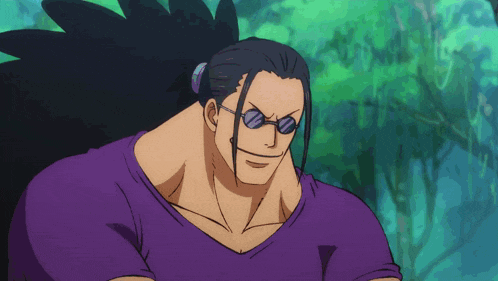 a man wearing sunglasses and a purple shirt