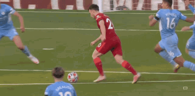 a soccer player with the number 20 on his back is kicking a soccer ball