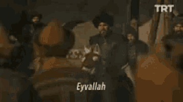 a man riding a horse with the words eyvallah written on the screen