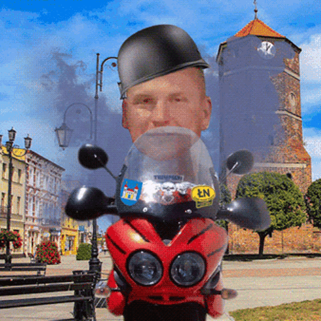a man on a motorcycle with a sticker on the windshield that says n1
