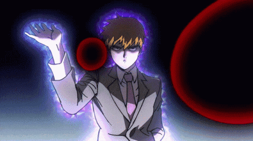 a man in a suit and tie is holding a red object