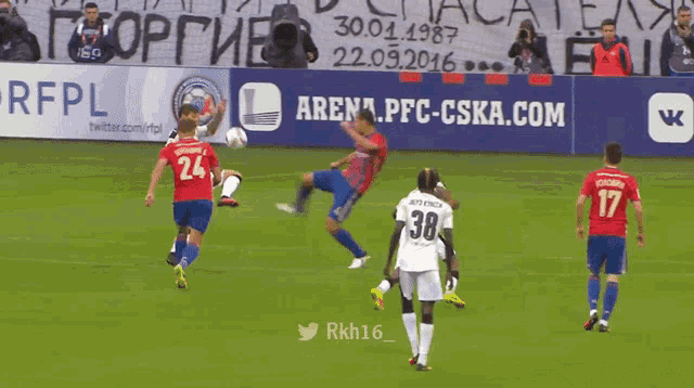 a group of soccer players on a field with arena.pfc-cska.com behind them