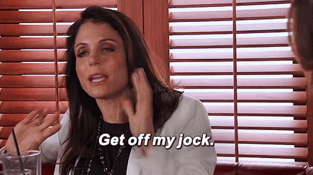 a woman says get off my jock while sitting in front of shutters