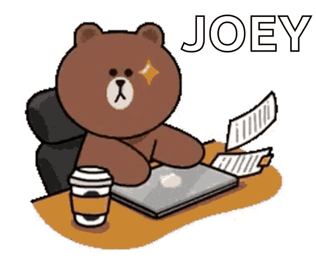 a brown teddy bear is sitting at a desk with a laptop and a coffee cup .