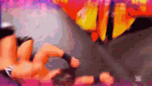 a blurry picture of a person holding a microphone with a w logo in the corner