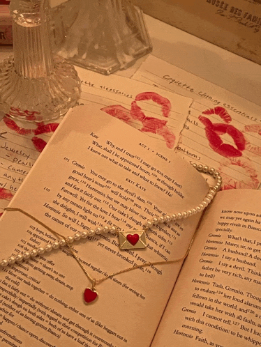 a book with a necklace on top of it