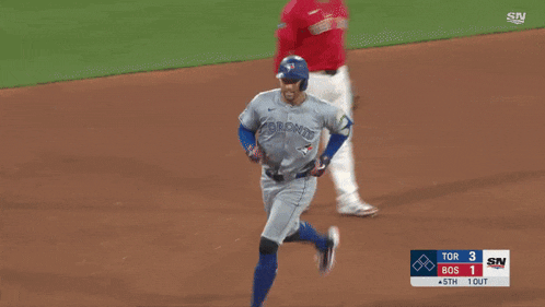 a baseball player with the number 51 on the back of his jersey is running on the field