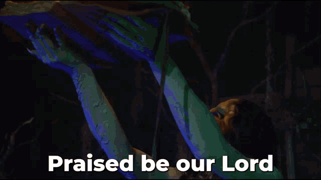 a person holding a torch with the words praised be our lord below