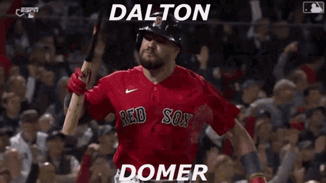 a baseball player for the red sox is holding a bat in front of a crowd