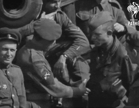 a black and white photo of soldiers with pathe written on the bottom left