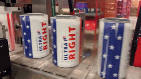 three cans of ultra right are sitting on a conveyor belt