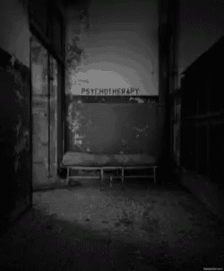 a black and white photo of a room with the word psychotherapy on the wall