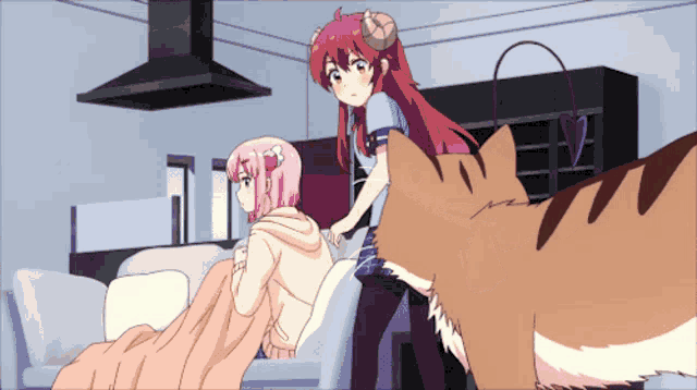 a girl with horns is standing next to another girl with horns