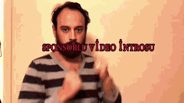 a man in a striped shirt with sponsorlu video introsu written in red