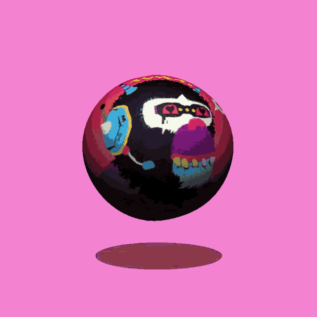 a colorful ball with a monkey face painted on it