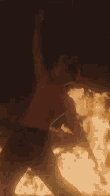 a pixel art of a person with a purple shirt