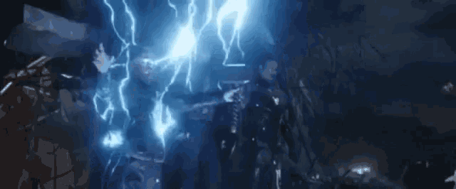 thor is being struck by lightning in a dark room in avengers : age of ultron .