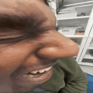 a close up of a person 's face with their eyes closed .