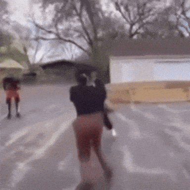 a blurry picture of people walking down a street