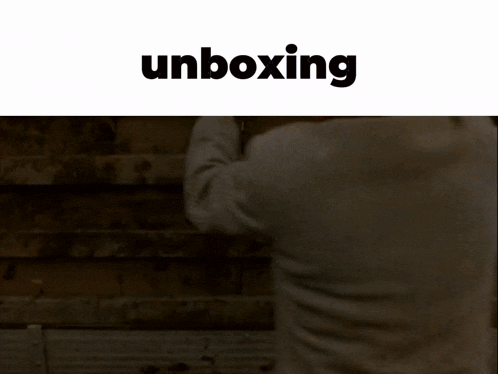 a blurred image of a person with the word unboxing above them