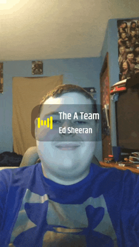 a man is wearing a blue shirt with the a team ed sheeran written on it
