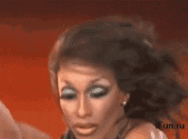 a close up of a woman 's face with a red background and the word fun.ru on the bottom