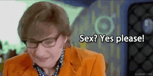a woman wearing glasses and an orange jacket is talking about sex .