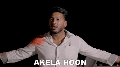 a man in a white shirt has blood on his shirt and the word akela hoon is on the bottom