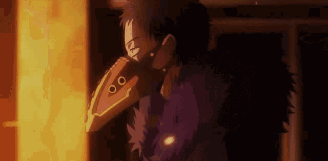 a man wearing a mask and a feathered jacket is standing in front of a fire .