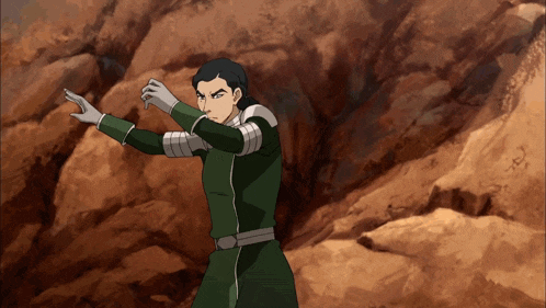 a cartoon character in a green suit and white gloves stands in front of rocks