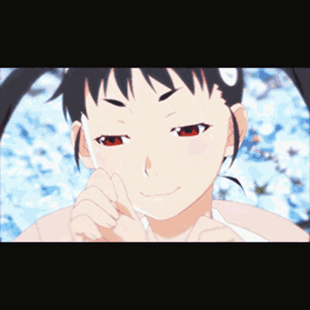 a close up of a girl with red eyes making a funny face