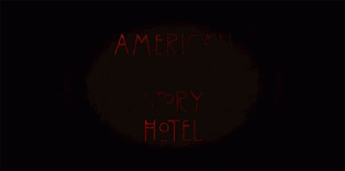 a neon sign that says american horror story hotel on it
