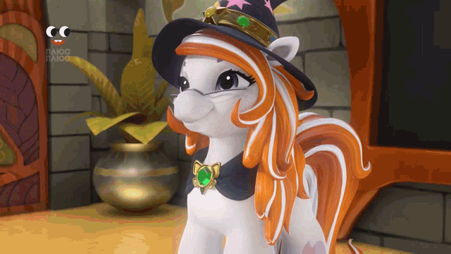 a cartoon pony wearing a witch hat with a green emerald