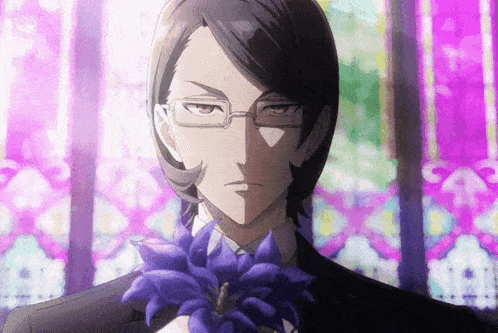 a man with glasses is holding a blue flower in his hand
