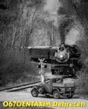 a black and white photo of a train crossing a railroad crossing with the words 0670entaxim debrecen below it