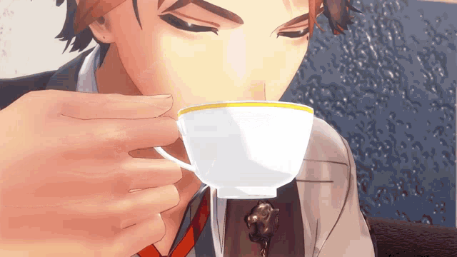 a man in a suit is drinking from a white cup