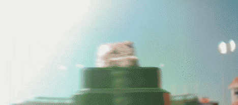 a blurred image of a green object with a white background