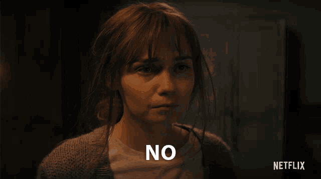 a woman with a surprised look on her face says no