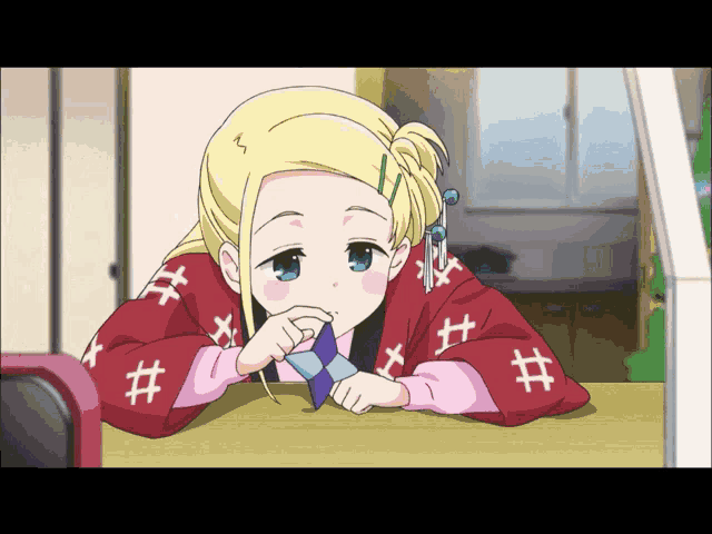 a girl with blonde hair and blue eyes is wearing a red sweater with the numbers # on it