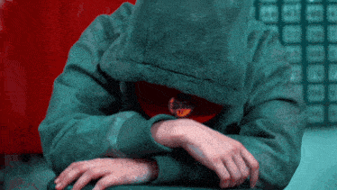 a person wearing a hoodie with a new era hat on their neck